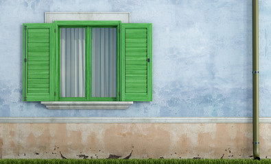 Old house with green wooden windows