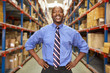 © Monkey Business - Portrait Of Businessman In Warehouse