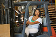 © Monkey Business - Woman Driving Fork Lift Truck In Warehouse