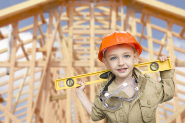 Child Boy Dressed Up as Handyman in Front of House Framing