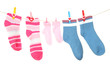 © Africa Studio - Colorful socks hanging on clothesline, isolated on white