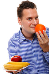 young man with fruits isolated