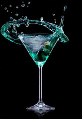 Wall Mural - Martini drink over dark background