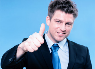Happy business man holding thumbs up