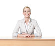 © Karramba Production - Young business woman sitting at a desk, isolated