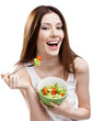 © Karramba Production - Dieting woman eats green salad in salad bowl, isolated on white