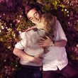 © VectorART - Beautiful young couple lying on a meadow