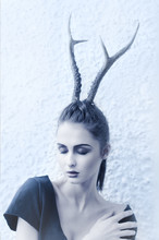 Beautiful Girl In The Image Of A Deer. Photo In Cold Tones