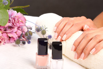 Sticker - Woman in a nail salon receiving a manicure