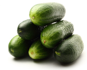 Fresh green cucumbers on white