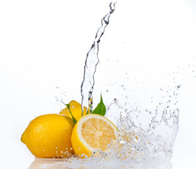 Wall Mural - Fresh lemons with water splash, isolated on white background