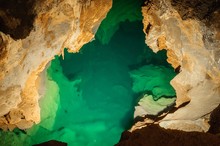 Underground Lake Sorrunded By Rocks