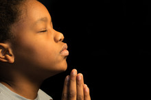 Praying African American Boy