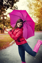 Happy Woman With Pink Umbrella And Rubber Boots