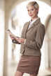 © jeffreyjcoleman - Elegant business woman with a clipboard.