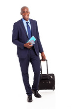 African Business Traveller With Trolley Bag And Air Ticket