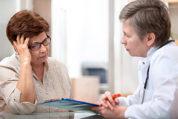 Wall Mural - Female patient tells the doctor about her health complaints