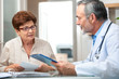 © Alexander Raths - Doctor talking to his female patient at office