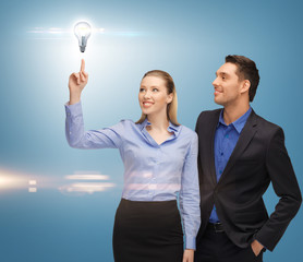 Poster - man and woman with light bulb