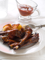 Canvas Print - Ribs with tomato sauce