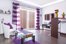 Modern White Living Room Interior With Purple Decorations
