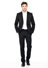 portrait of smiling businessman in black suit