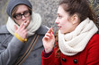 © pikselstock - Young couple smoking