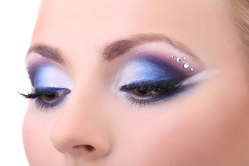 Beautiful female eyes with bright blue make-up