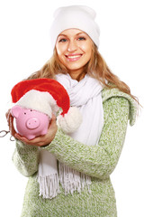 Wall Mural - Young beautiful woman with piggy bank