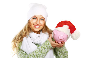 Wall Mural - Young beautiful woman with piggy bank