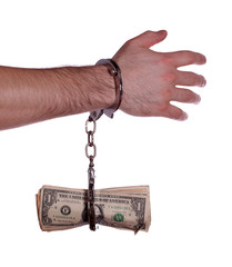 hand with handcuff and dollars