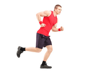 Wall Mural - Full length portrait of a fit muscular male athlete running