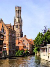 The Famous Belfry And Canal Scene In Bruges, Belgium