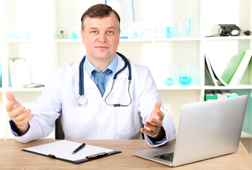 Poster - Medical doctor working at desk