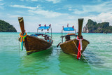 Fototapeta Natura - Boats at sea against the rocks in Thailand