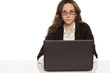 © vladimirfloyd - serious girl with glasses working on laptop on white background