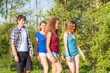 © william87 - Group of Teenage Friends Walking at Park