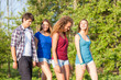 © william87 - Group of Teenage Friends Walking at Park