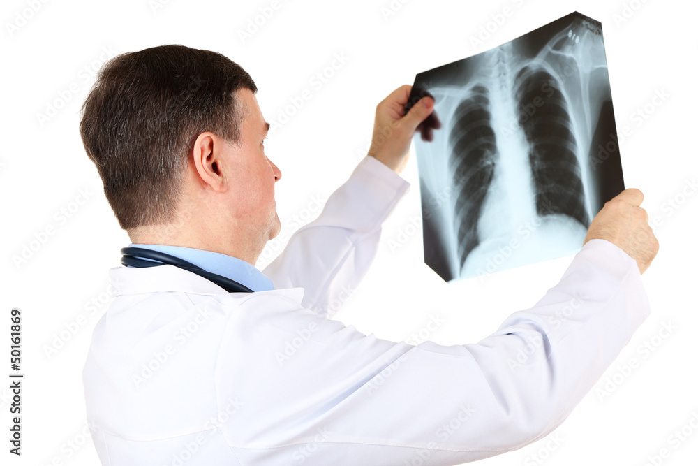 Medical doctor analysing x-ray image  isolated on white