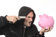 man with gun and pink piggy bank