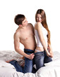 young man undressing his girlfriend
