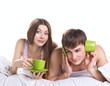 young couple in bed with communication problems