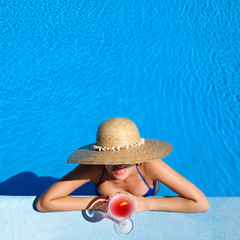 Poster - Woman at poolside with cosmopolitan cocktail