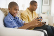 © JGI/Jamie Grill/Blend Images - Father and son playing video games