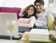 © JGI/Jamie Grill/Blend Images - Mixed race couple watching television on laptop