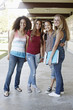 © Peathegee Inc/Blend Images - School friends standing in portico