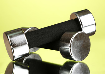 Dumbbells at 2 kg on green background