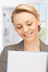 Poster - happy woman with big notepad