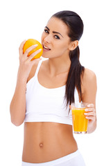 Wall Mural - Woman holding glass of fresh orange and glass of juice