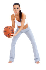 Wall Mural - Woman standing and holding basketball